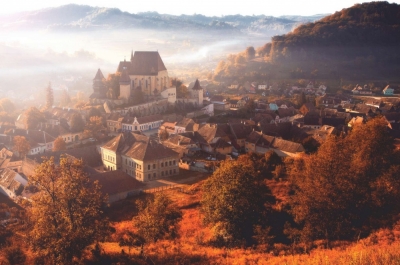 Morning fog over the village of Biertan, Romania